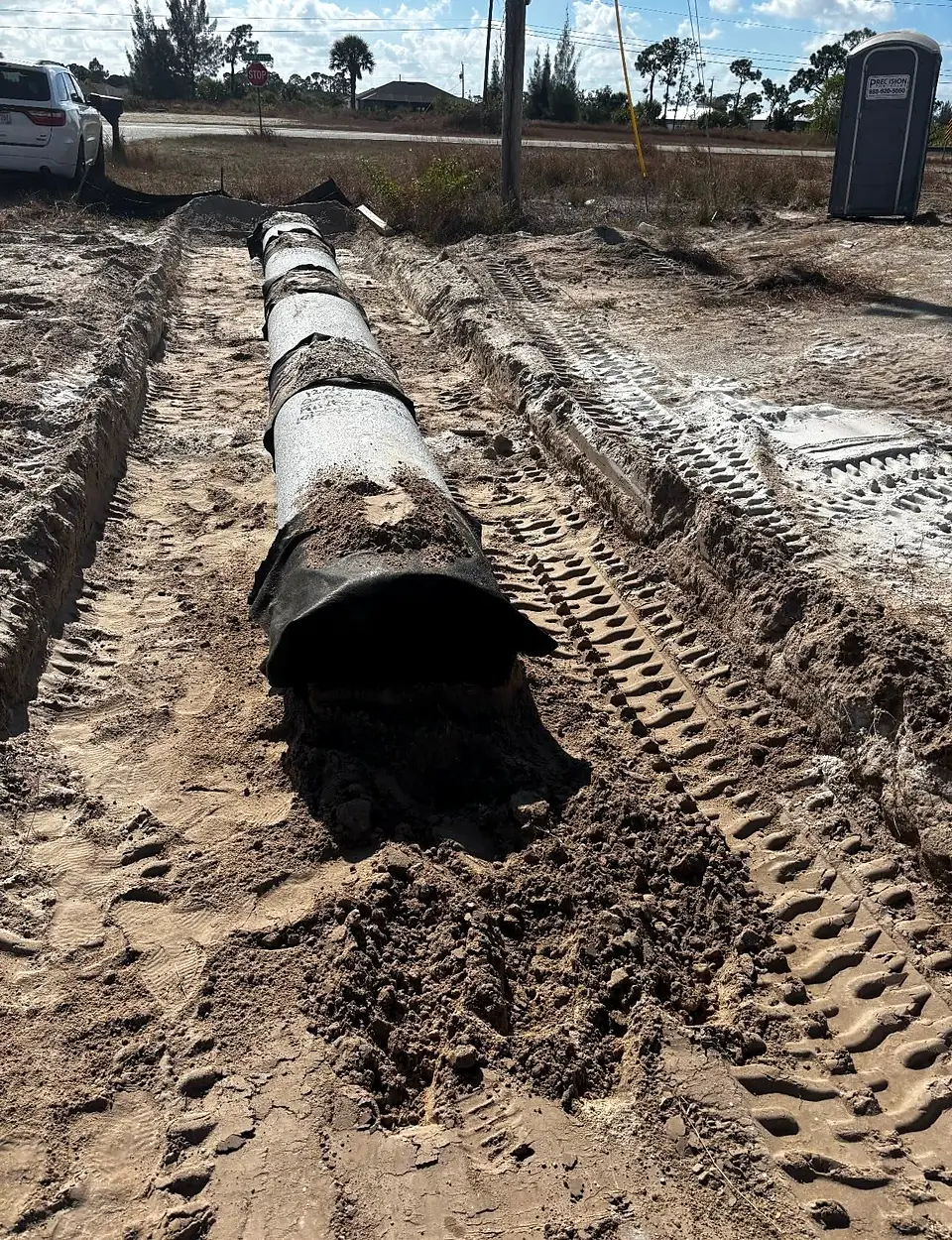 Pipe laid in a trench on a job site